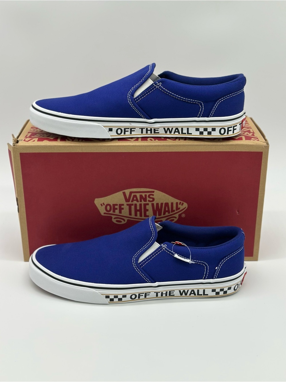 Vans Blue Slip-On Skate Shoes with Checkerboard Midsole